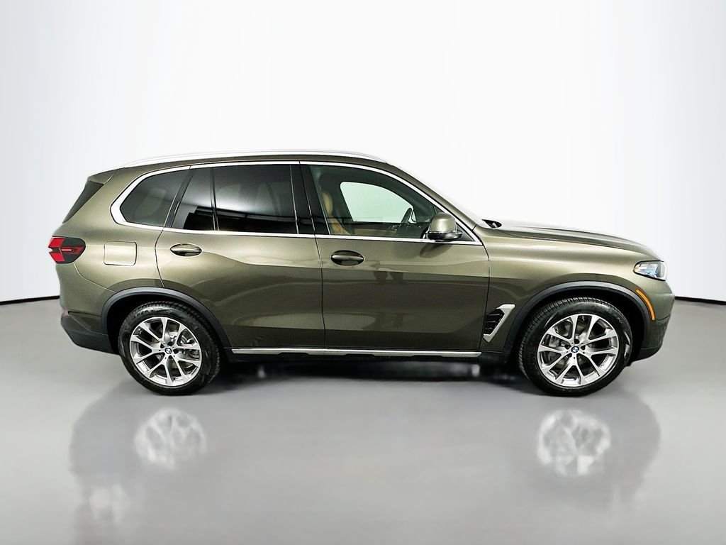Used 2026 Manhattan Green Metallic BMW xDrive50e image 4