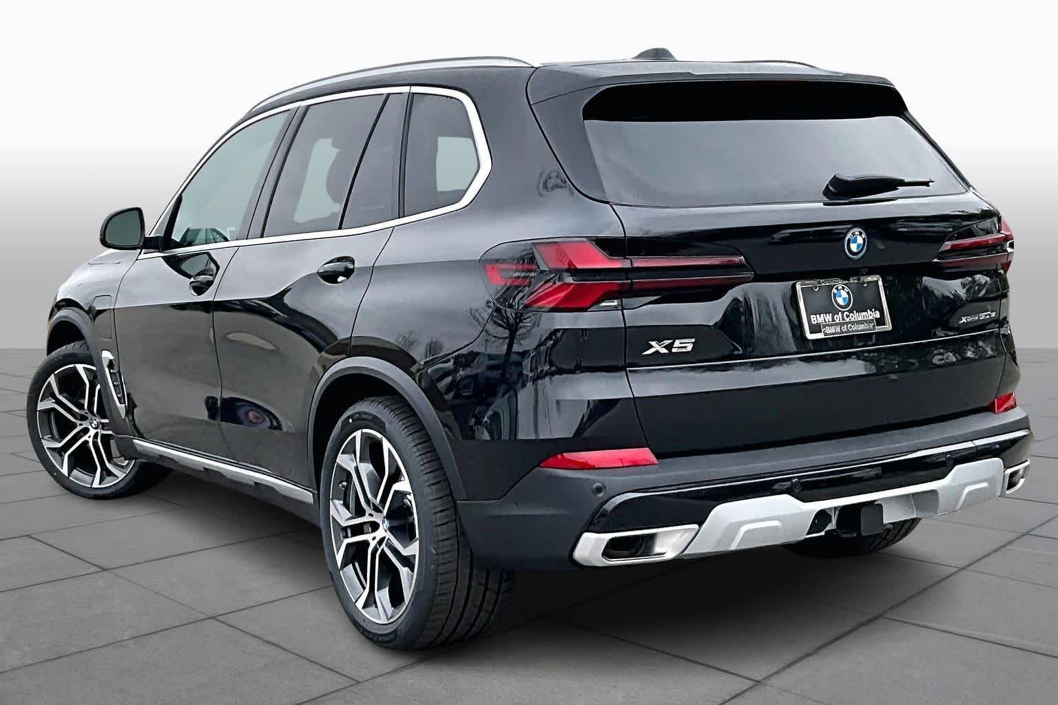 New 2026 Black Sapphire Metallic BMW xDrive50e image 12