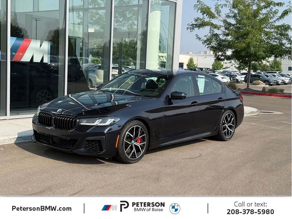 Used 2023 Black BMW M550i xDrive image 1