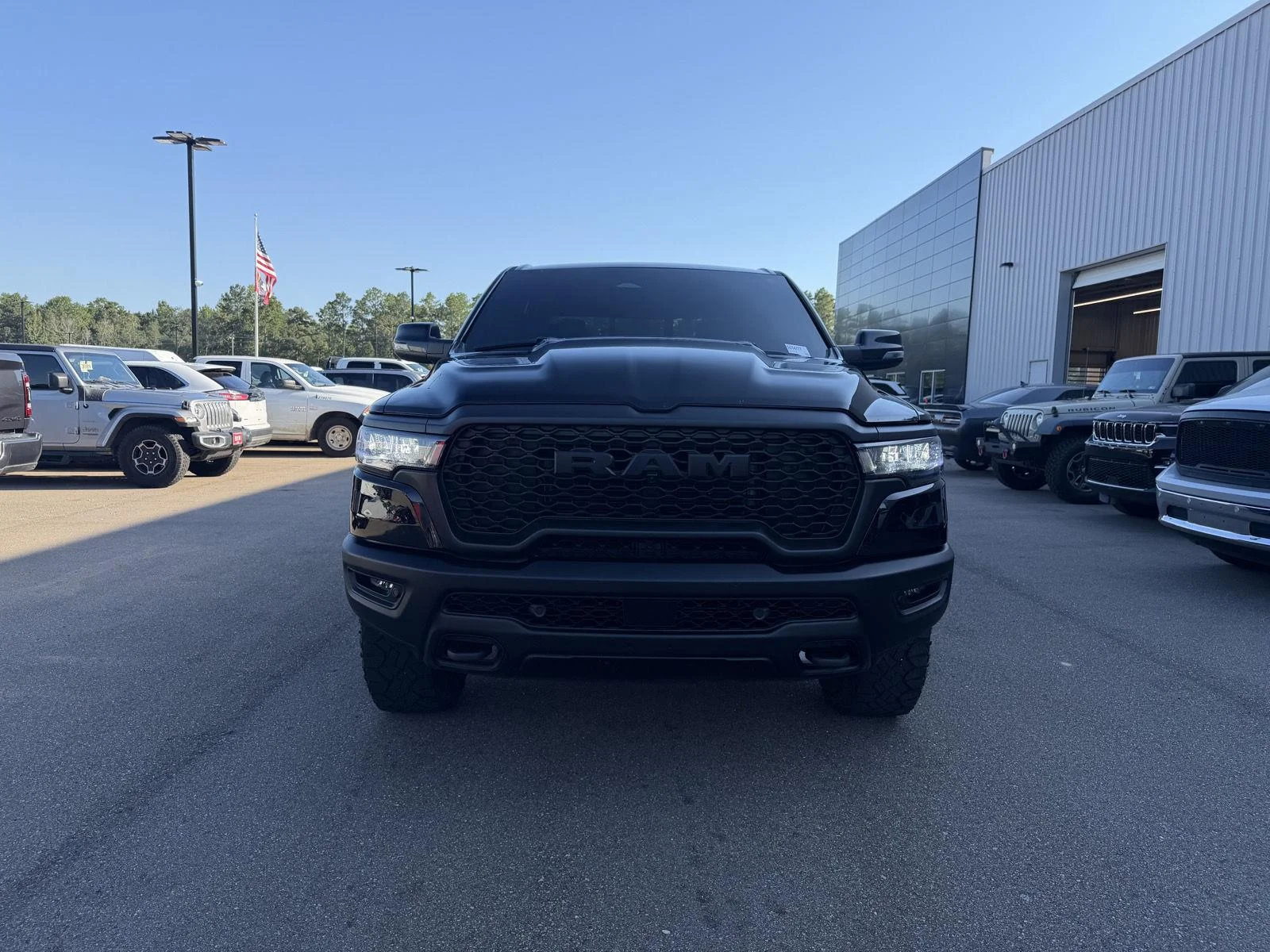 Used 2025 Diamond Black Crystal Pearlcoat Ram Rebel image 2