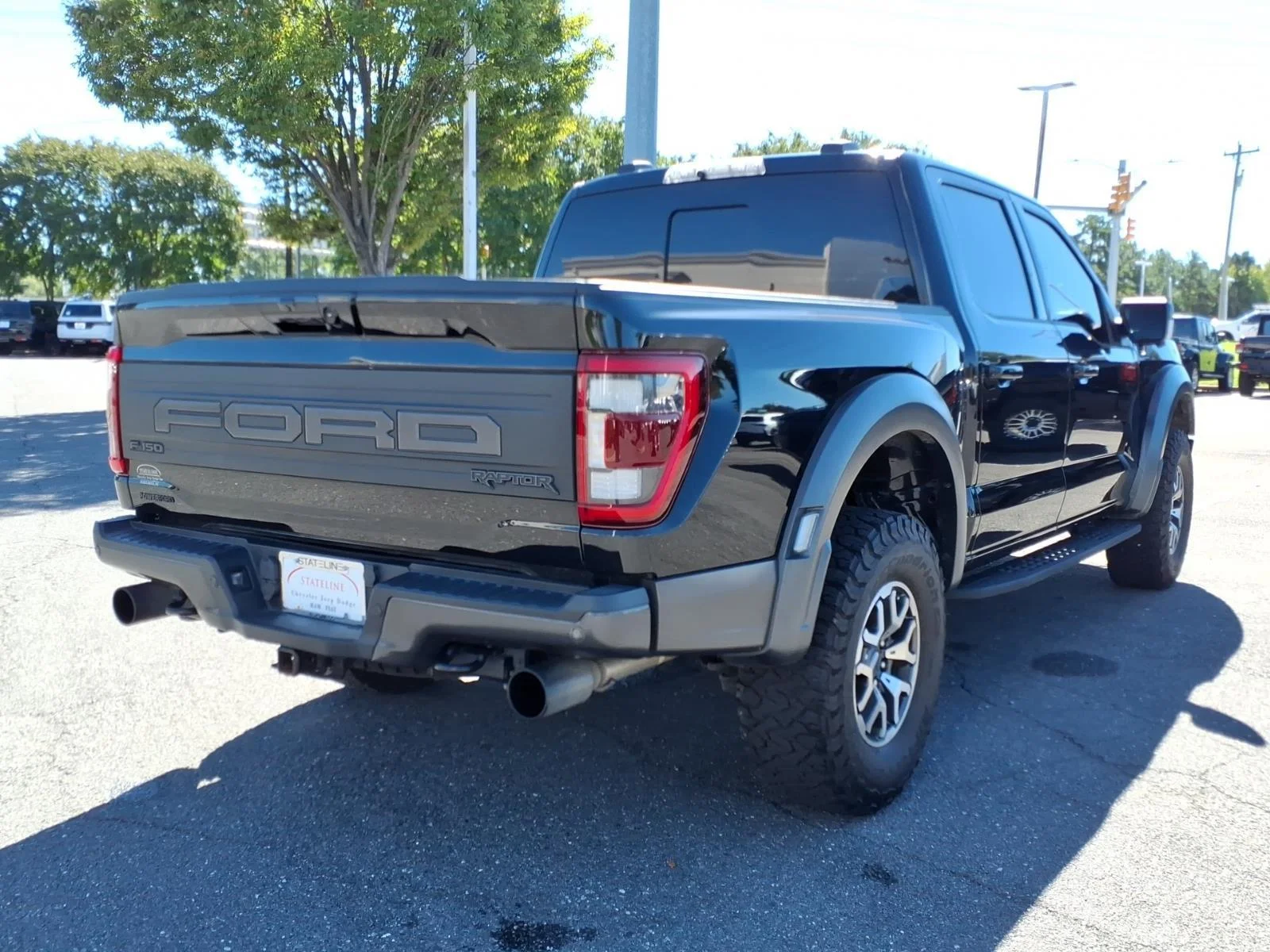 Used 2022 Agate Black Metallic Ford Raptor image 2