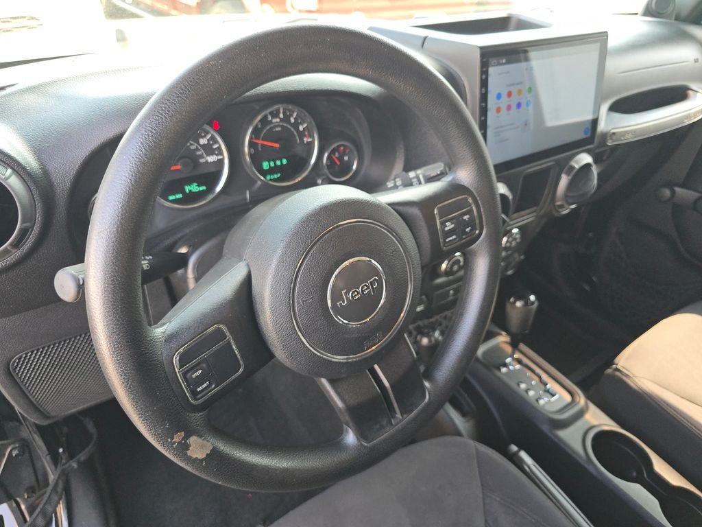 Used 2013 Black Jeep Unlimited Sport image 17