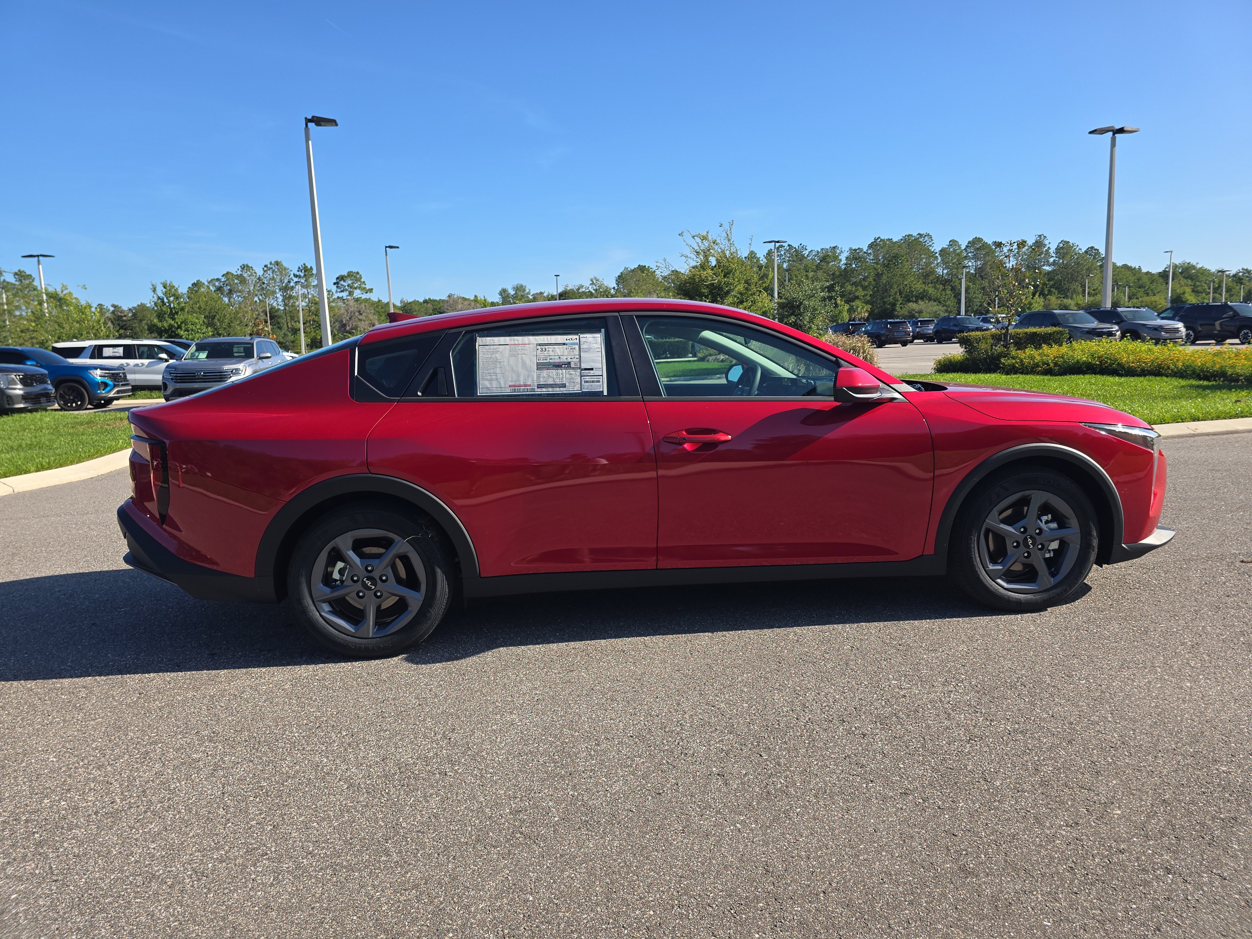 New 2026 Currant Red Kia LXS image 8