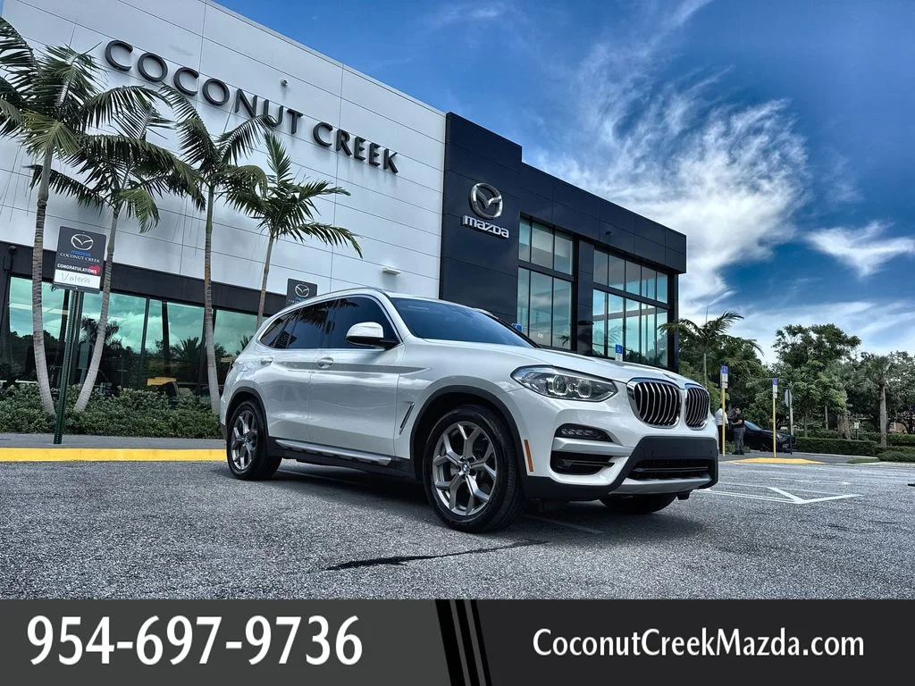 Used 2021 Alpine White BMW sDrive30i image 1
