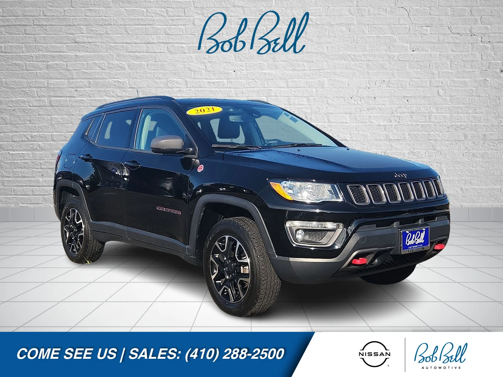 Used 2021 Diamond Black Jeep Trailhawk image 1
