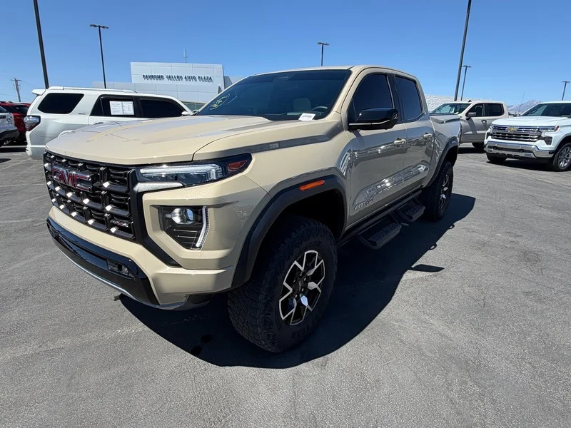 Used 2024 Desert Sand Metallic GMC AT4X image 7