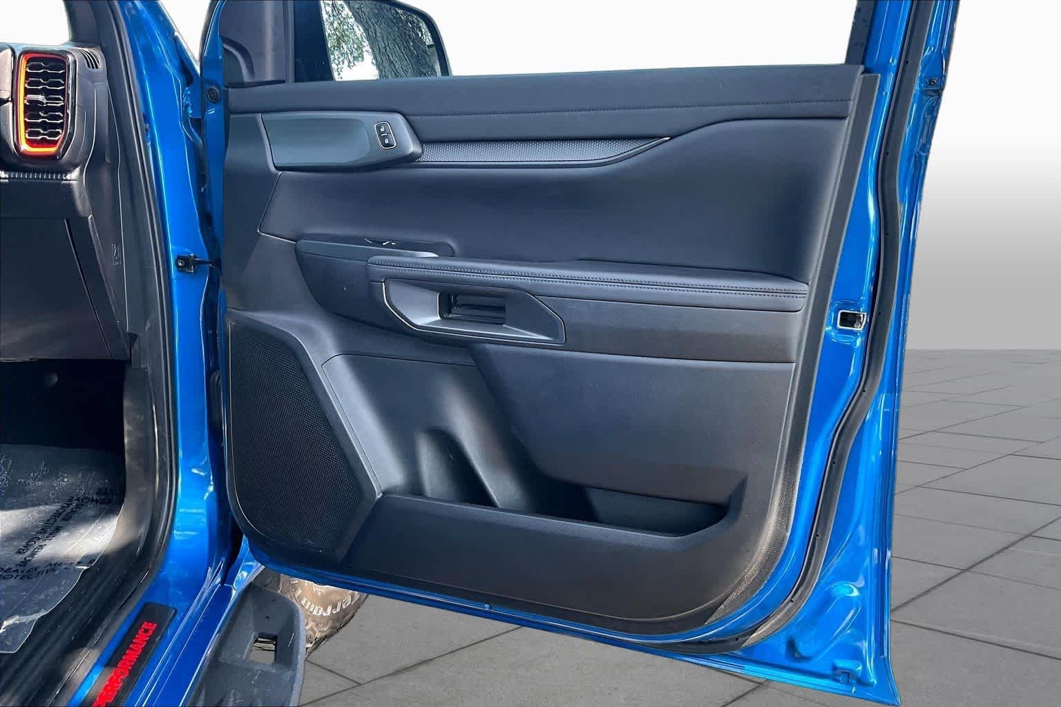Used 2024 Velocity Blue Metallic Ford Raptor image 23