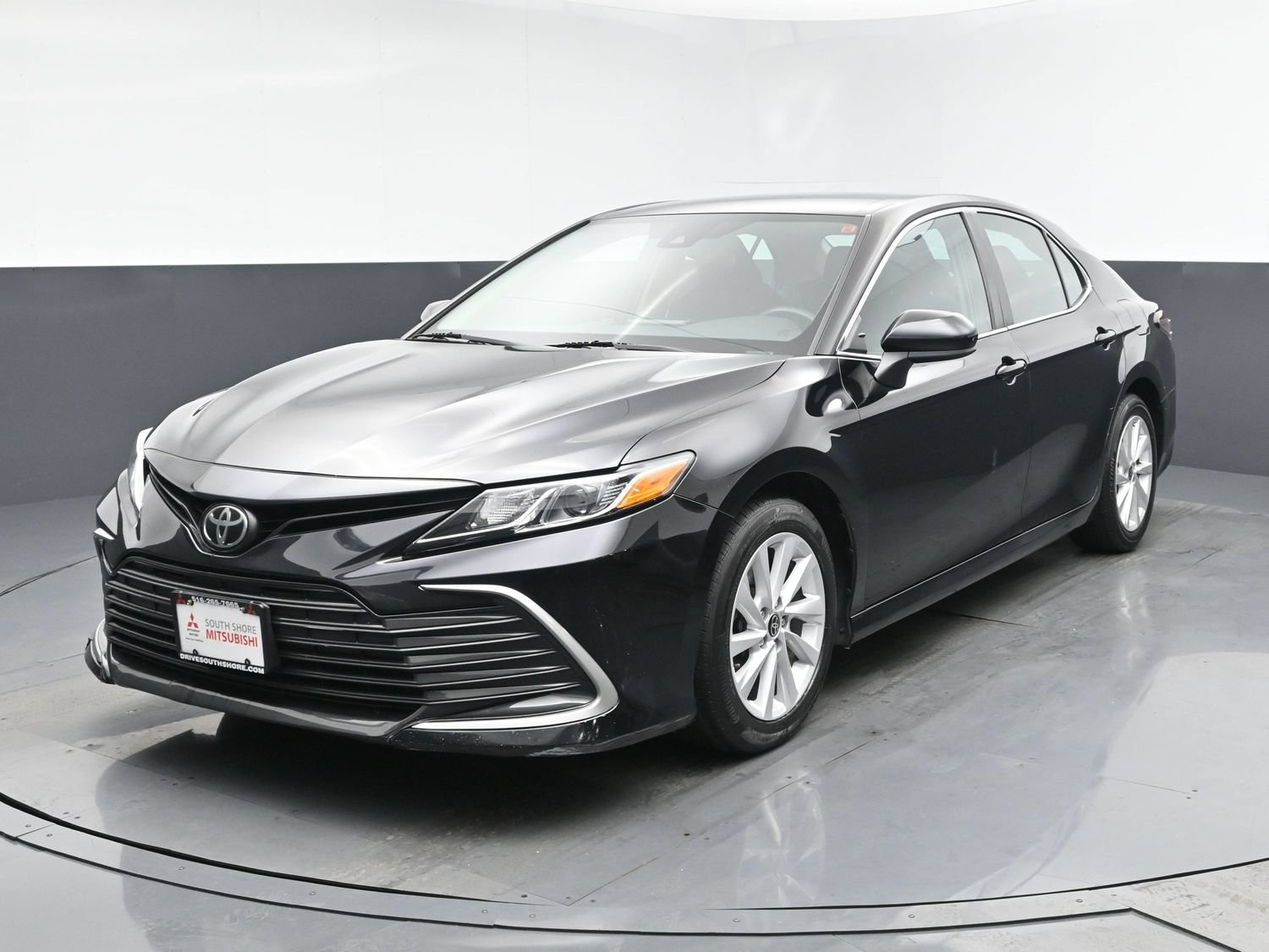 Used 2021 Midnight Black Metallic Toyota LE image 1
