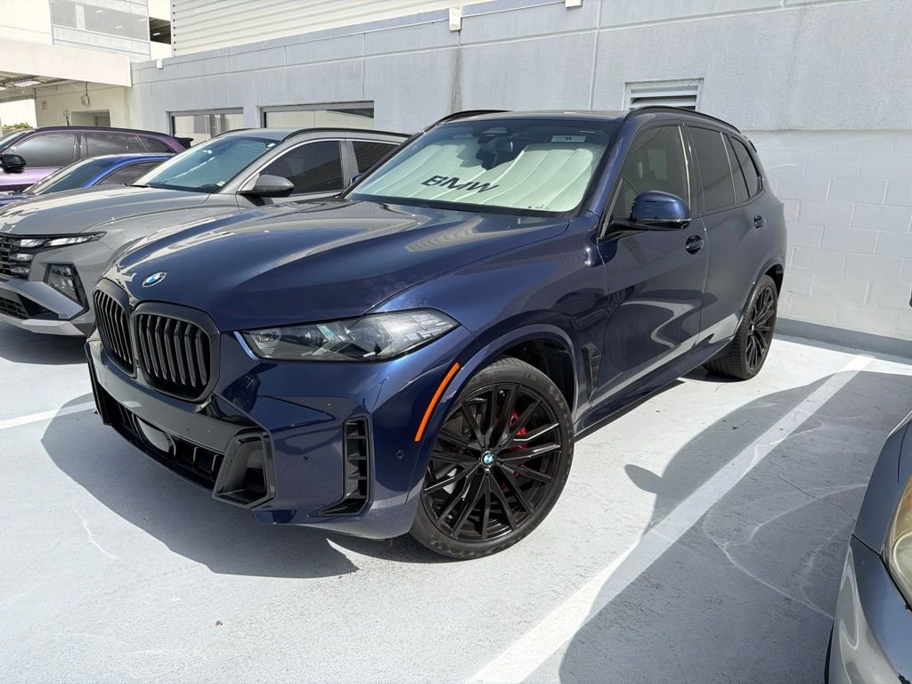Certified Used 2024 Tanzanite Blue II Metallic BMW sDrive40i image 1