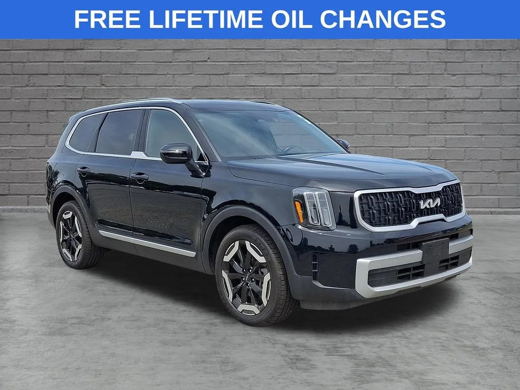 Used 2023 Ebony Black Kia EX image 1