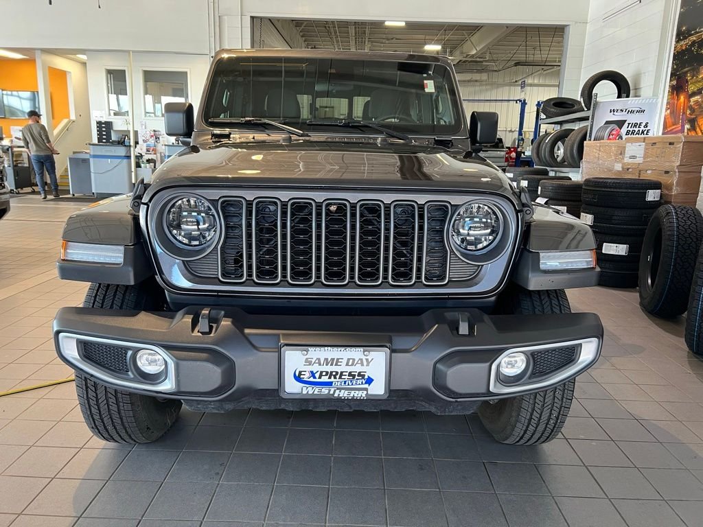 Used 2025 Granite Crystal Metallic Clear Jeep Sport S image 2