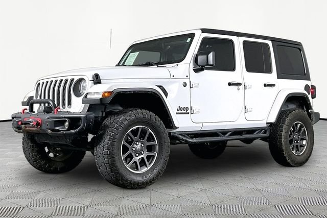 Used 2021 White Jeep Unlimited Sport image 1