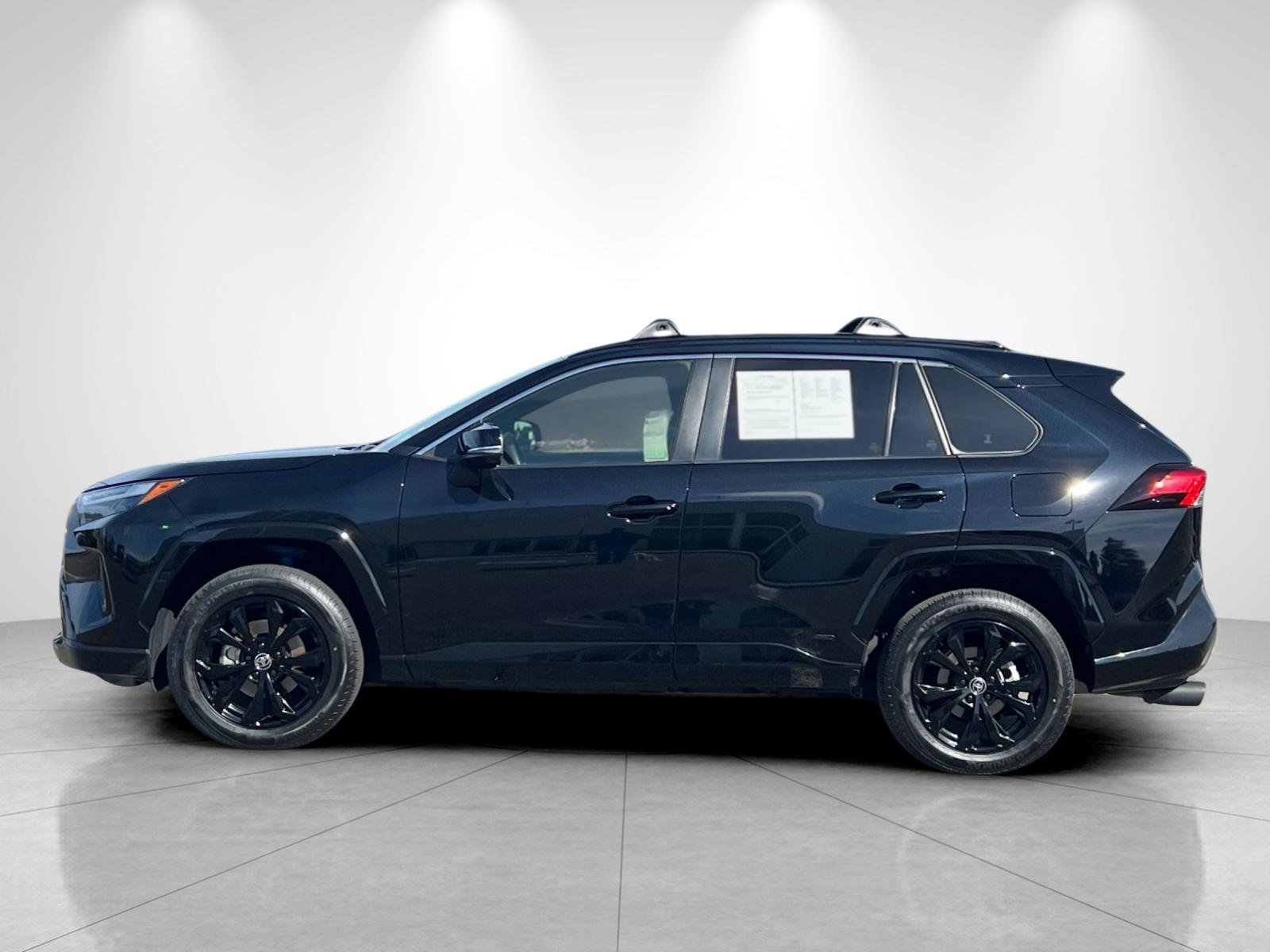 Used 2024 Midnight Black Metallic Toyota Hybrid SE image 2