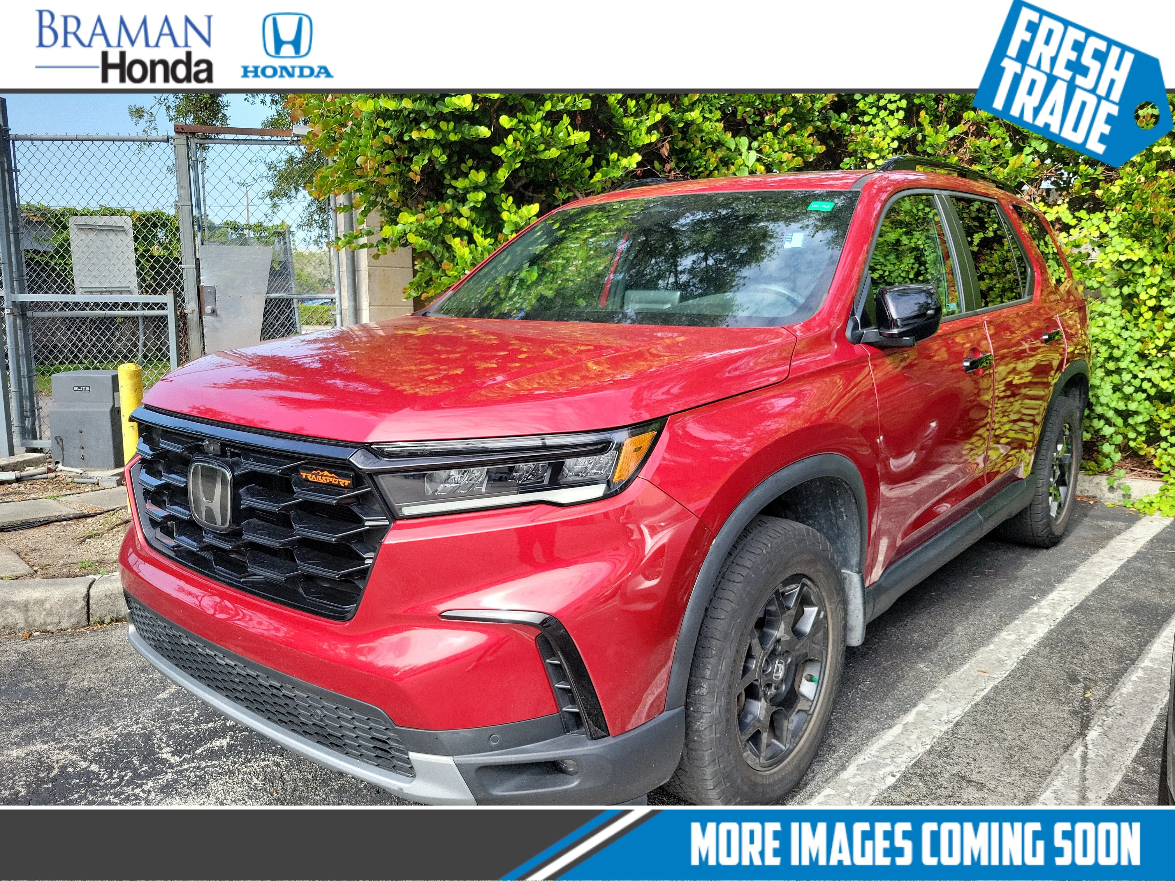 Certified Used 2024 Radiant Red Metallic II Honda AWD TRAILSPORT image 1