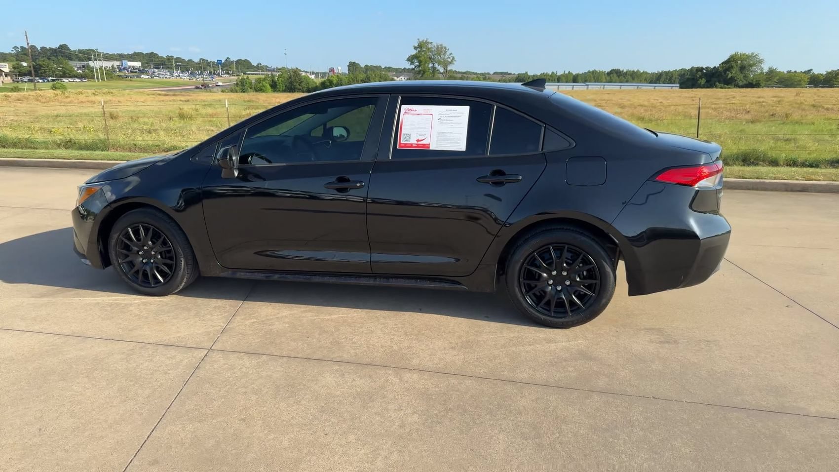 Used 2024 Midnight Black Metallic Toyota LE image 6