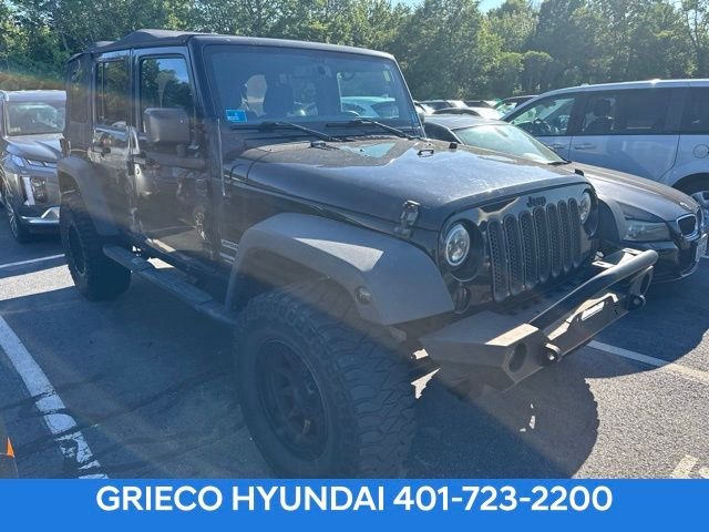 Used 2016 Black Jeep Unlimited Sport image 1