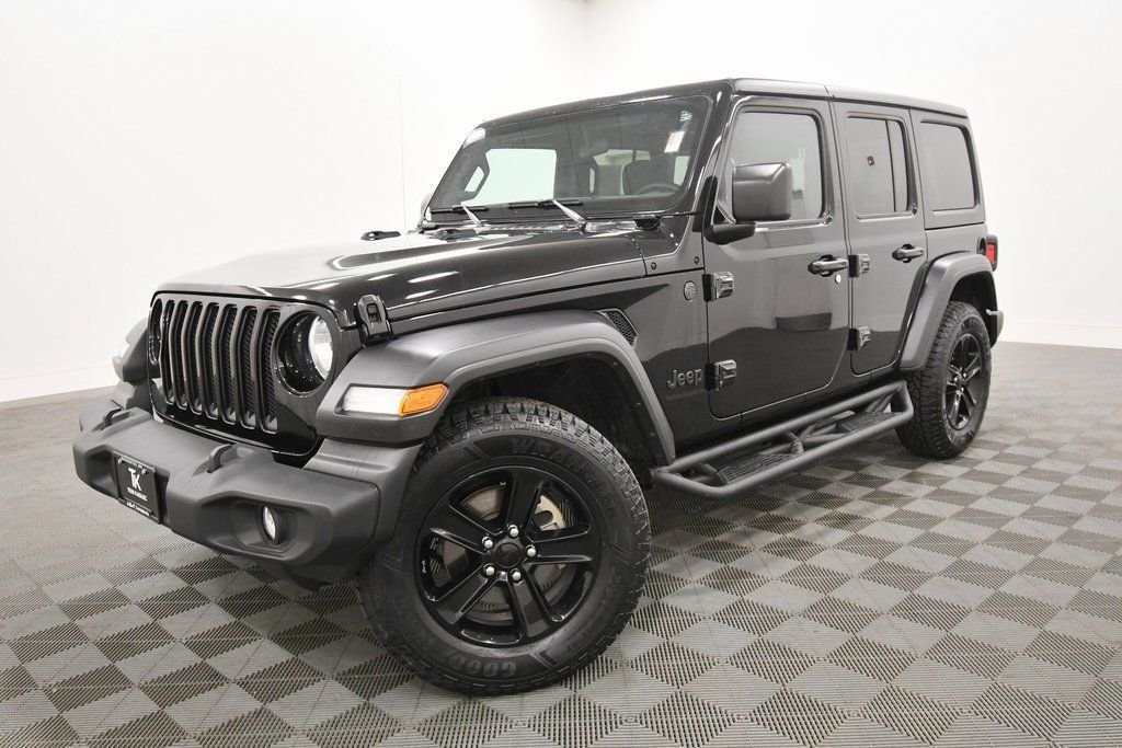 Used 2023 Jeep Wrangler 4-Door Altitude with VIN 1C4HJXDG7PW550075 for sale in Rochester, Minnesota