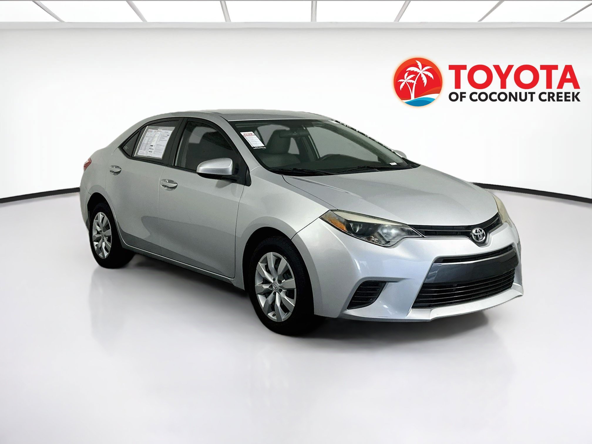 Used 2015 Classic Silver Metallic Toyota LE image 1