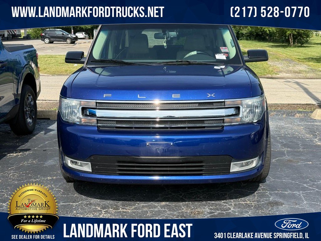 Used 2014 Deep Impact Blue Metallic Ford 4dr SEL AWD image 1