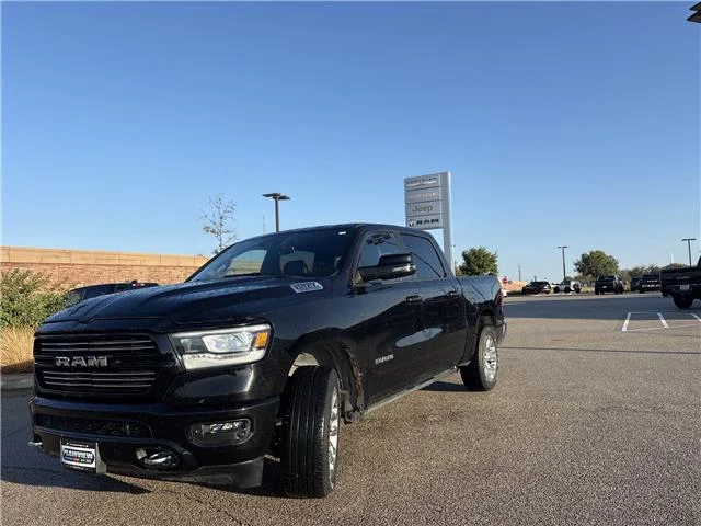 Used 2024 Diamond Black Crystal Pearlcoat RAM Laramie 4x4 Crew Cab 144.5 in. WB image 1