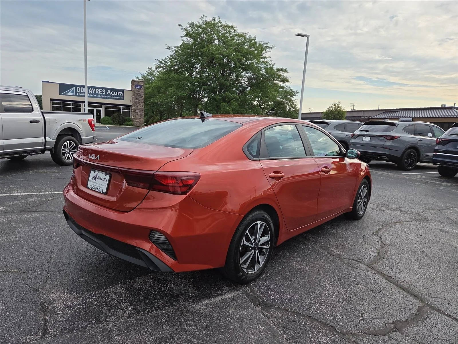 Used 2023 Fire Orange Kia LXS image 29
