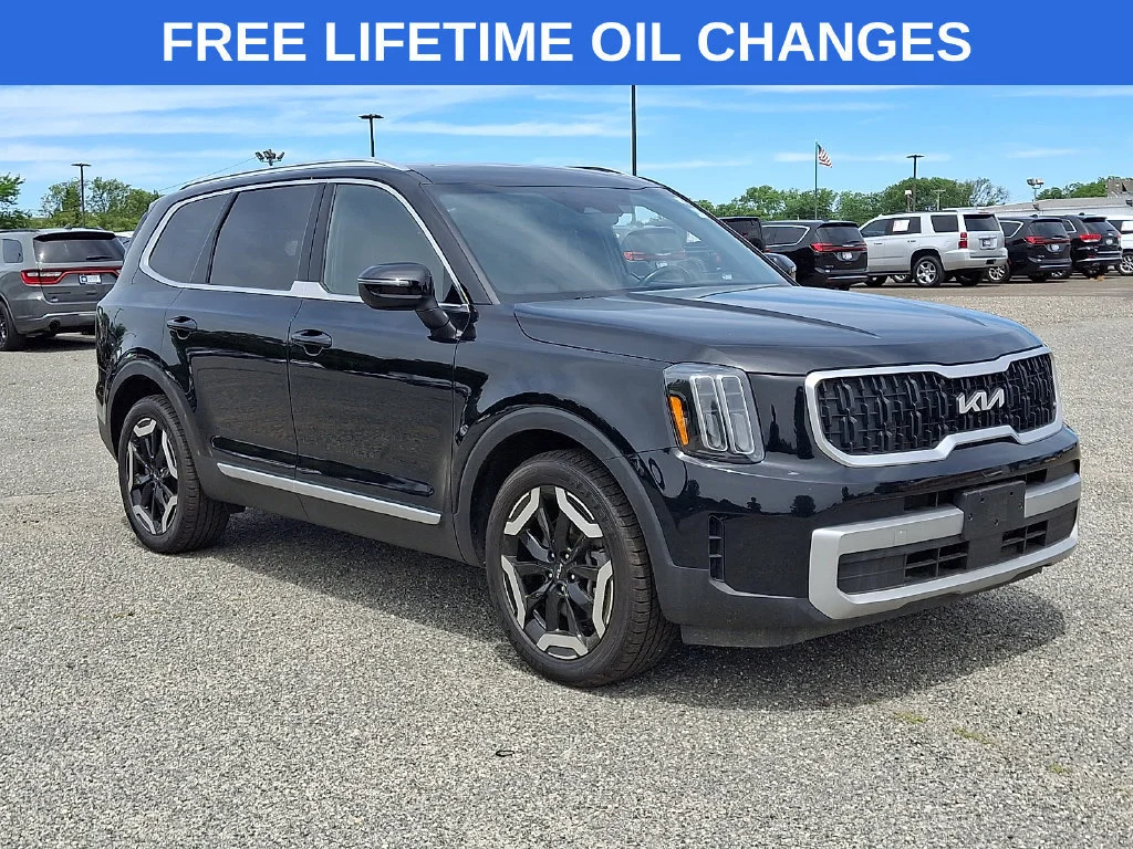 Used 2023 Ebony Black Kia EX image 1