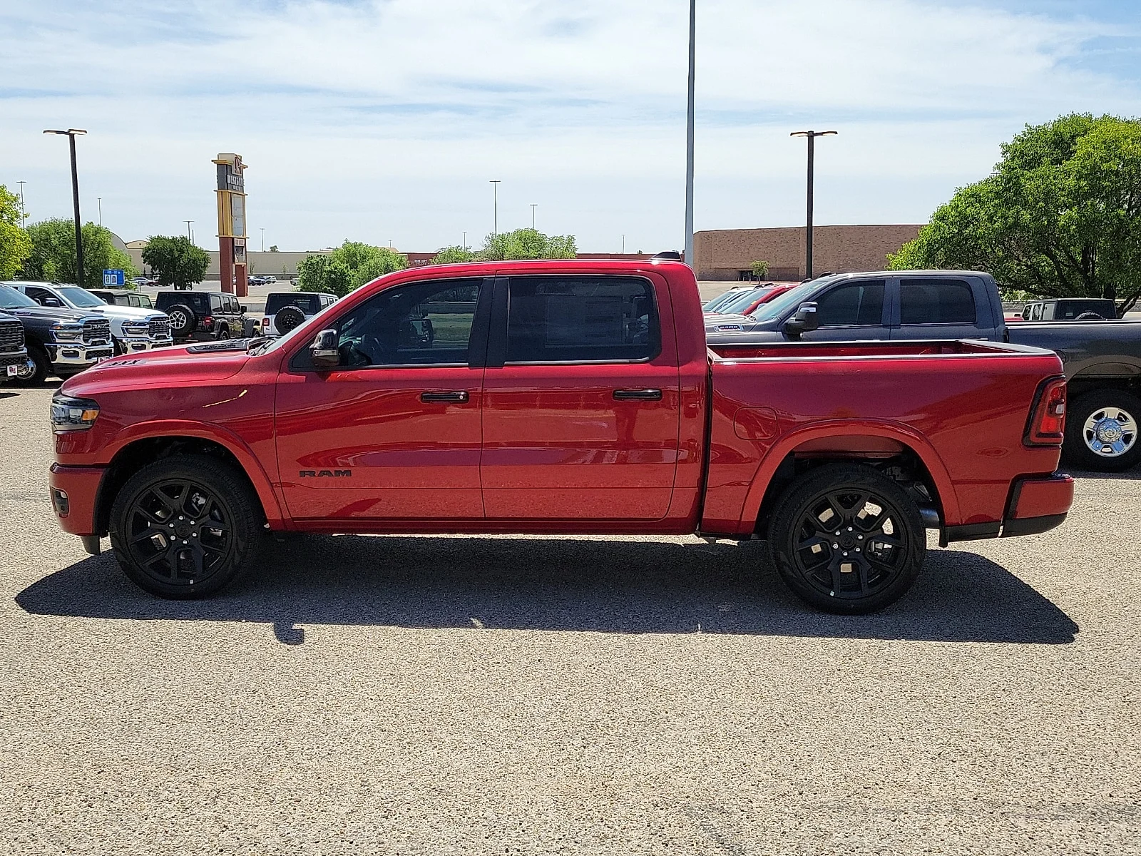 New 2026 PR6 Molten Red Ram LARAMIE CREW CAB 4X4 5