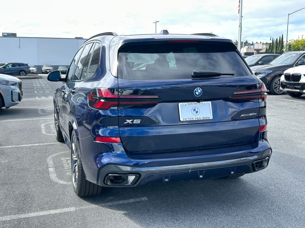 New 2026 Tanzanite Blue II Metallic BMW xDrive50e image 3