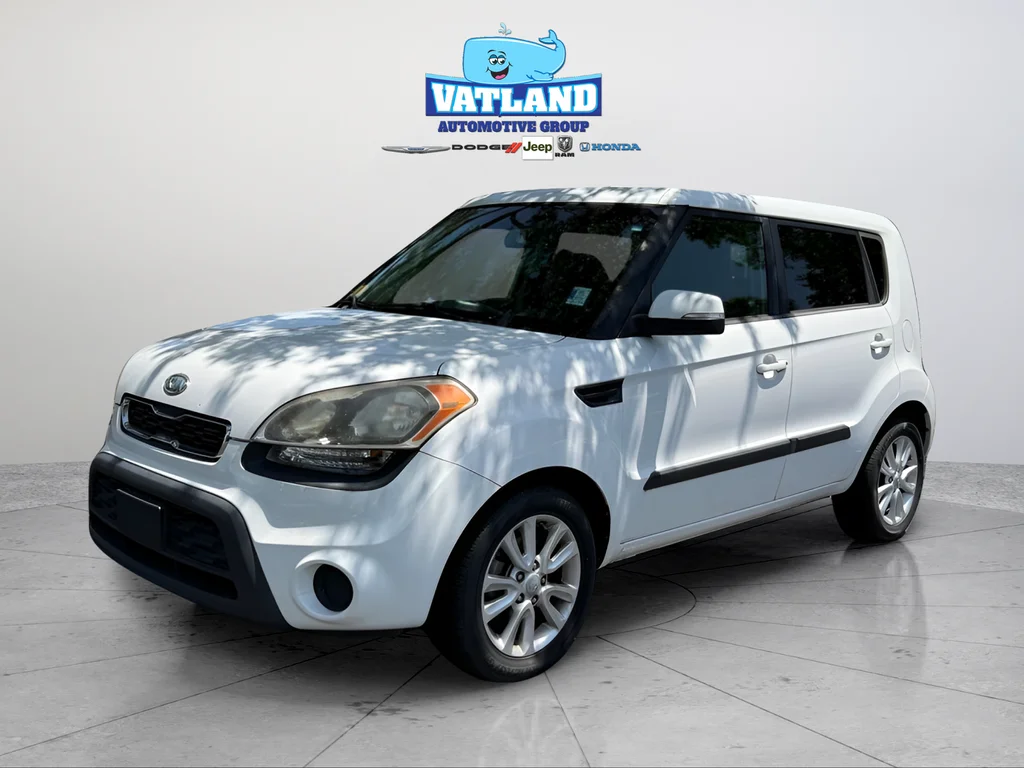 Used 2012 Clear White Kia Plus image 1