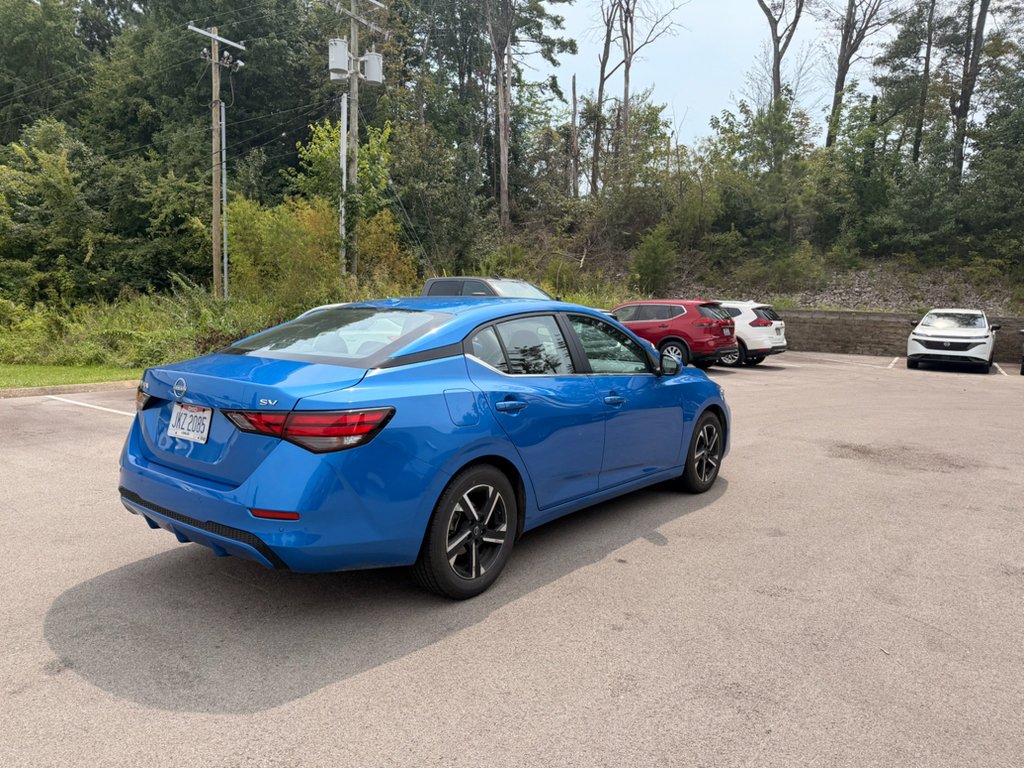 Used 2024 Electric Blue Metallic Nissan SV image 4
