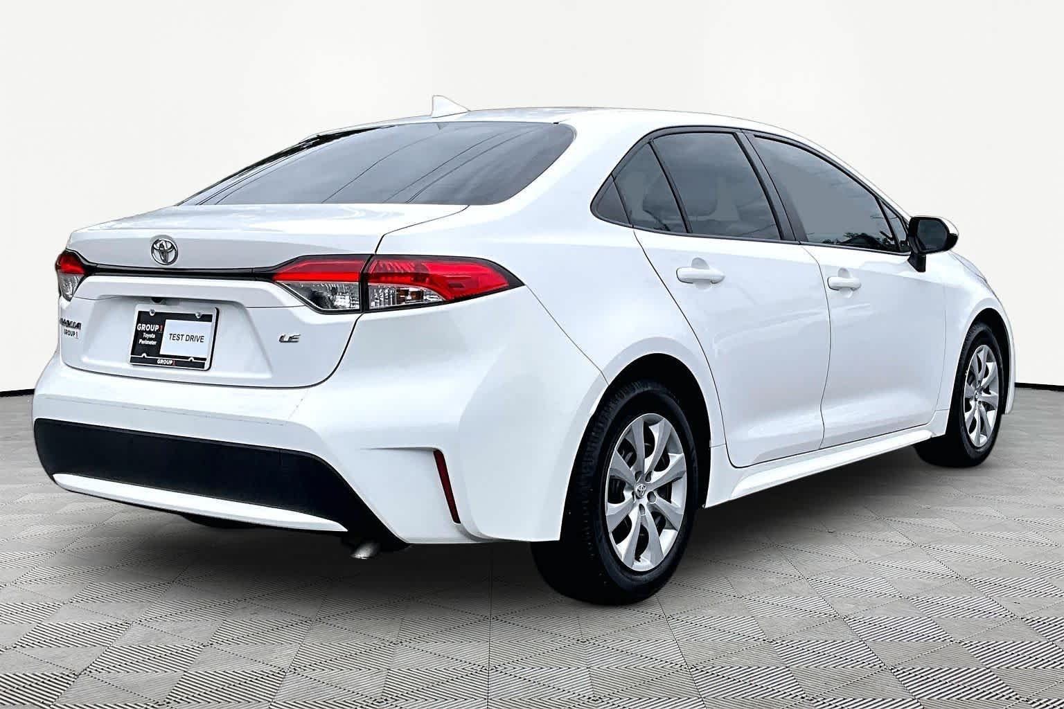 Used 2021 Super White Toyota LE image 13