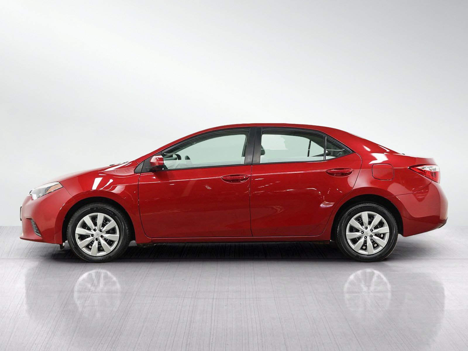 Used 2016 Barcelona Red Metallic Toyota LE image 2