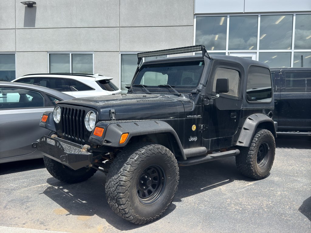 Used 2001 Black Jeep SE image 1