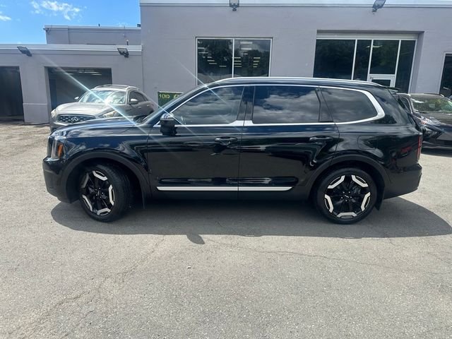 Used 2024 Ebony Black Kia EX image 3