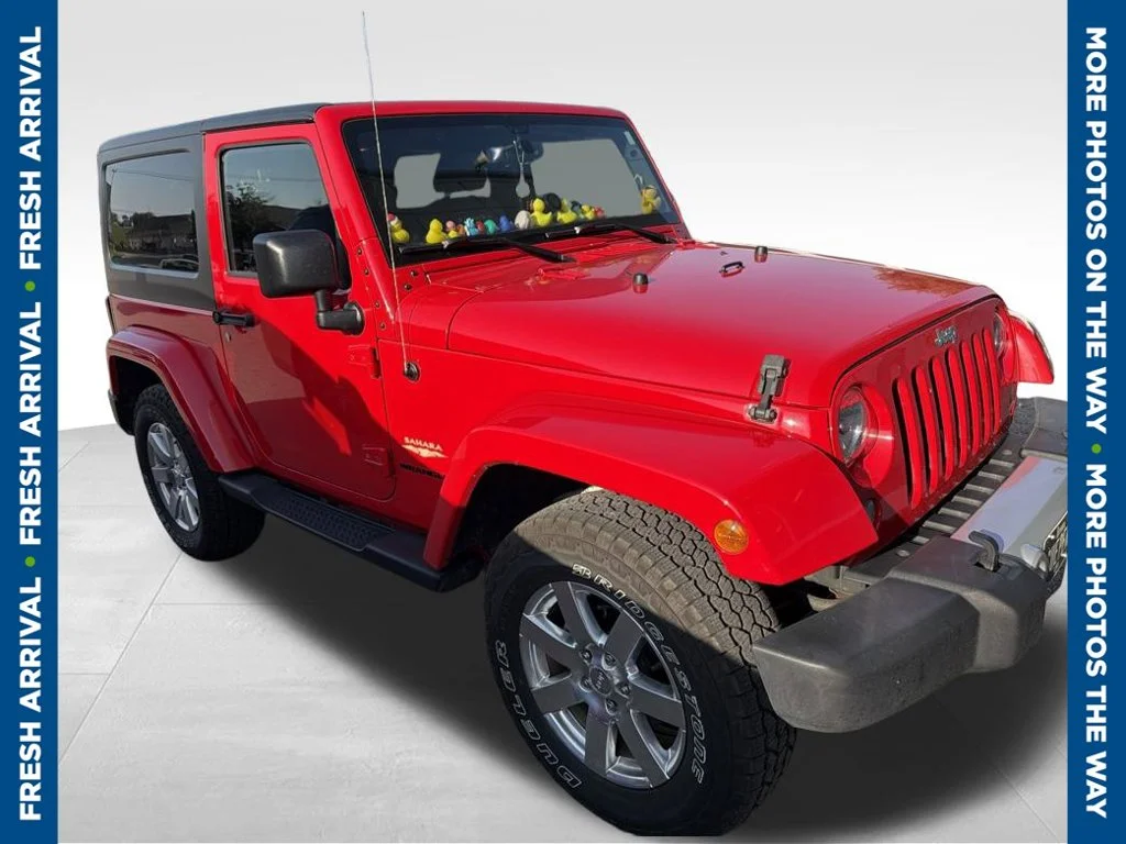 Used 2015 Red Jeep Sahara image 1
