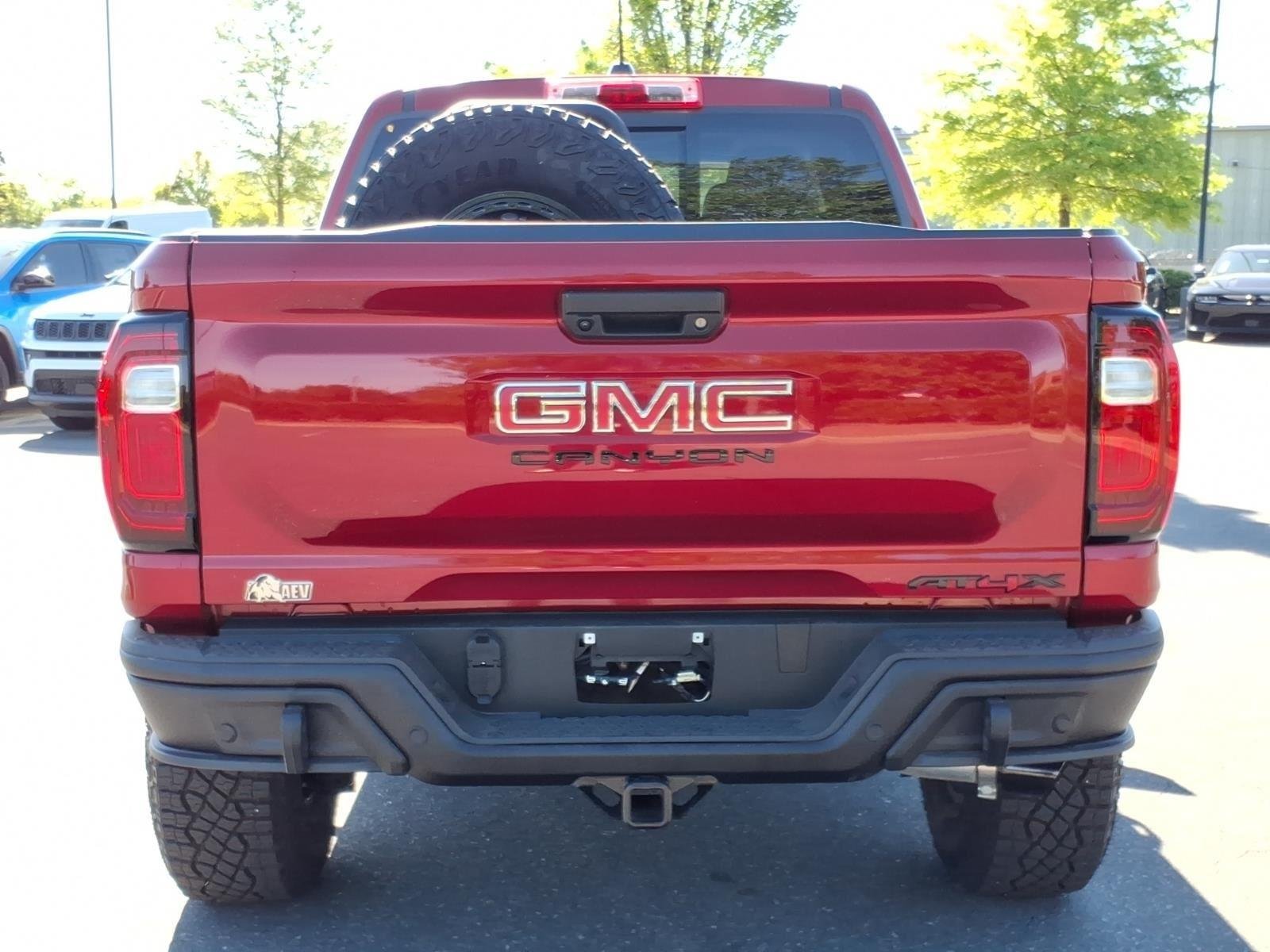 Used 2024 Volcanic Red Tintcoat GMC 4WD AT4X image 17