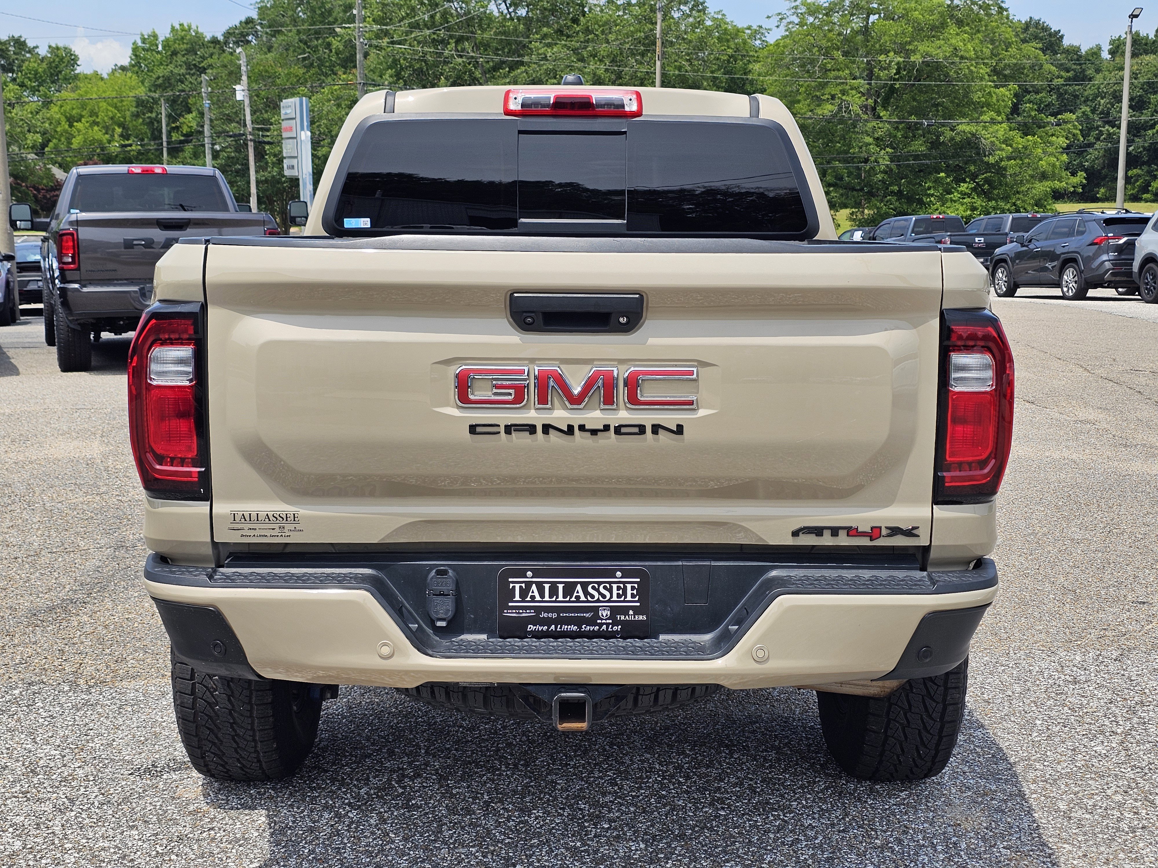 Used 2023 Desert Sand Metallic GMC 4WD AT4X image 11