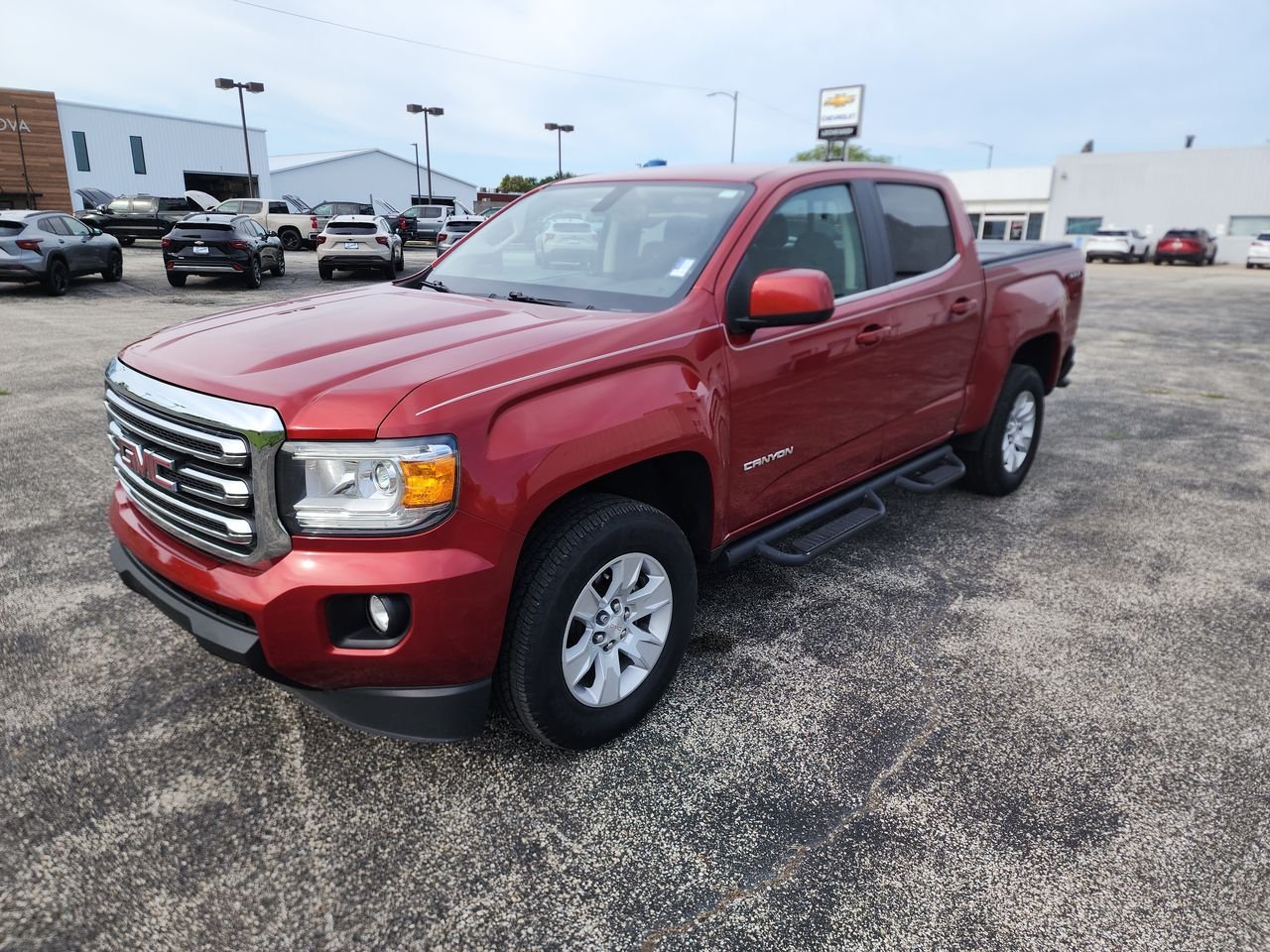 Used 2016 COPPER RED METALLIC GMC 4WD SLE image 4