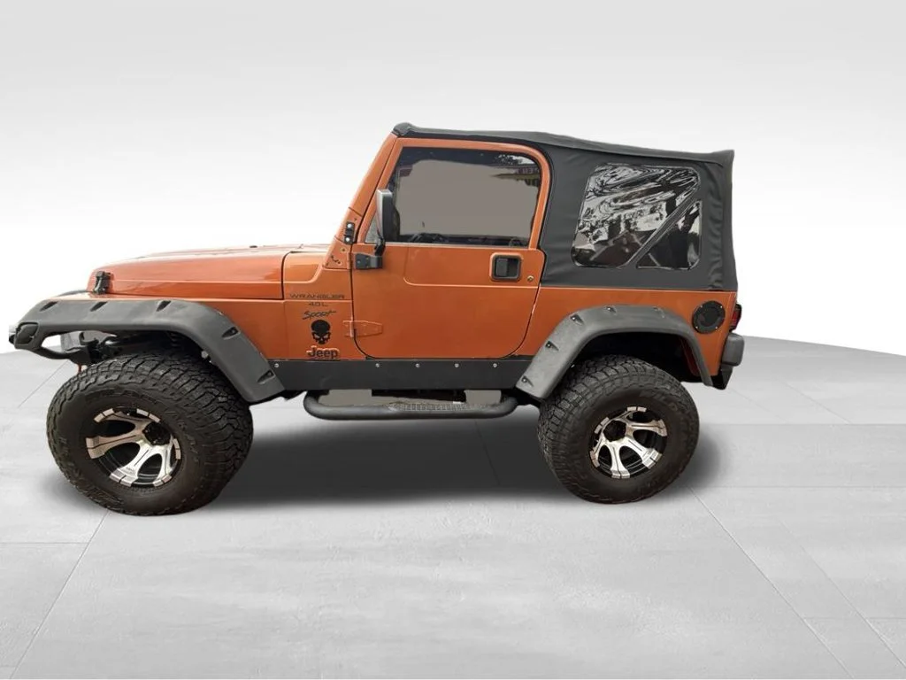 Used 2000 Orange Jeep Sport image 2