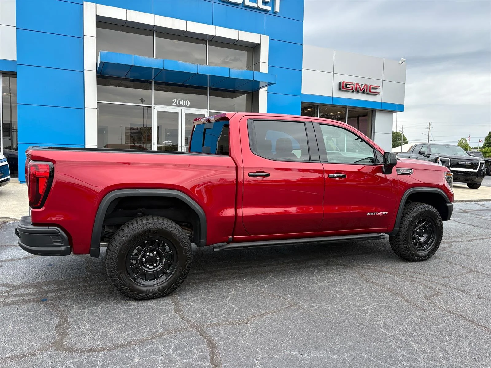 Used 2026 Volcanic Red Tintcoat GMC AT4X image 5