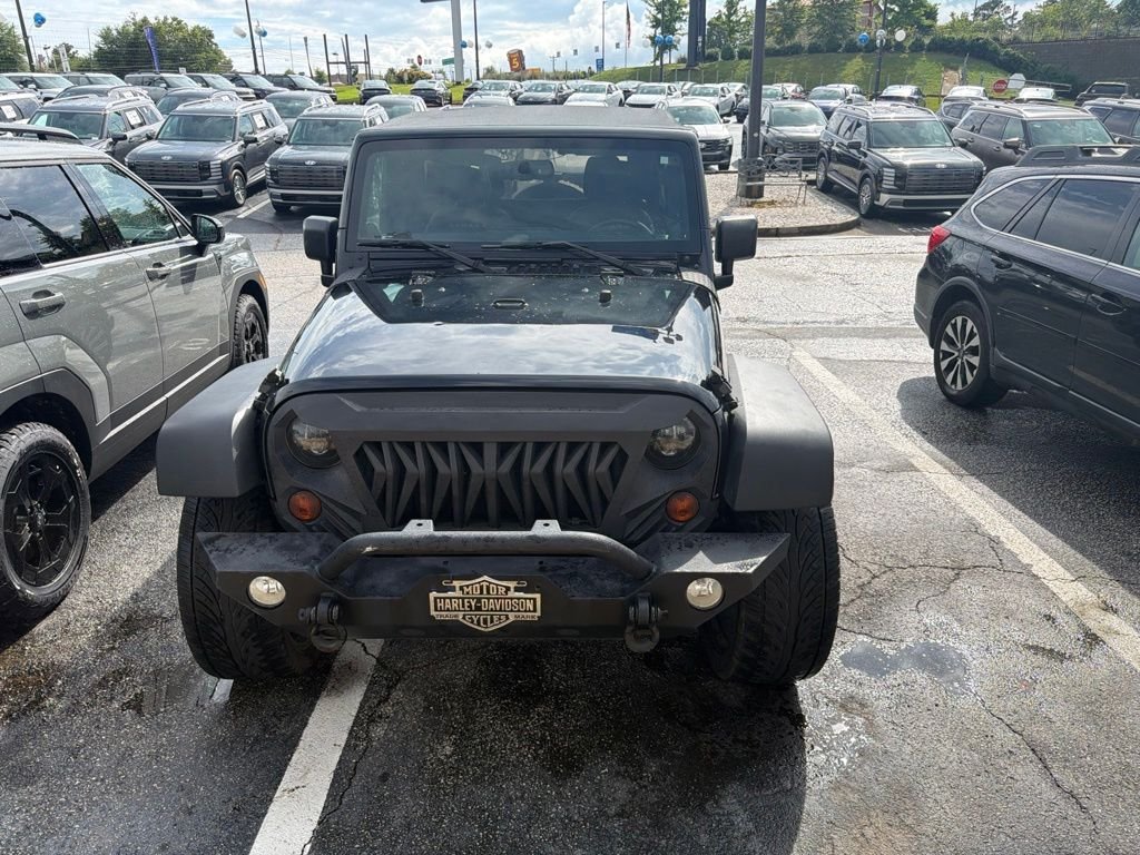 Used 2013 Black Jeep Unlimited Sahara image 1