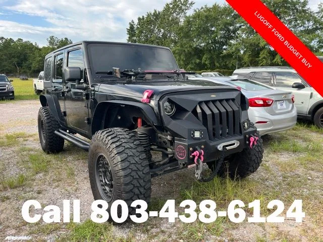 Used 2013 Black Clearcoat Jeep Unlimited Sport image 1