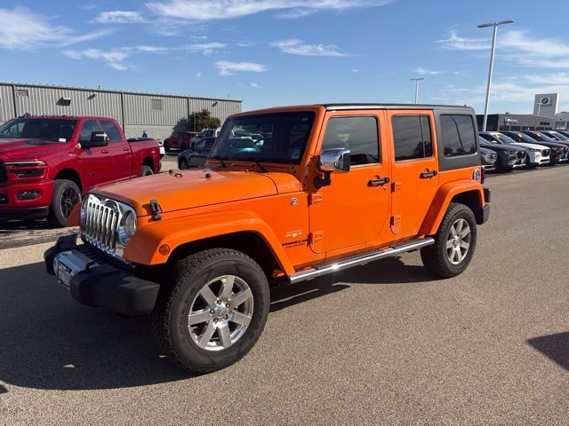 Used 2012 Orange Jeep Unlimited Sahara image 2