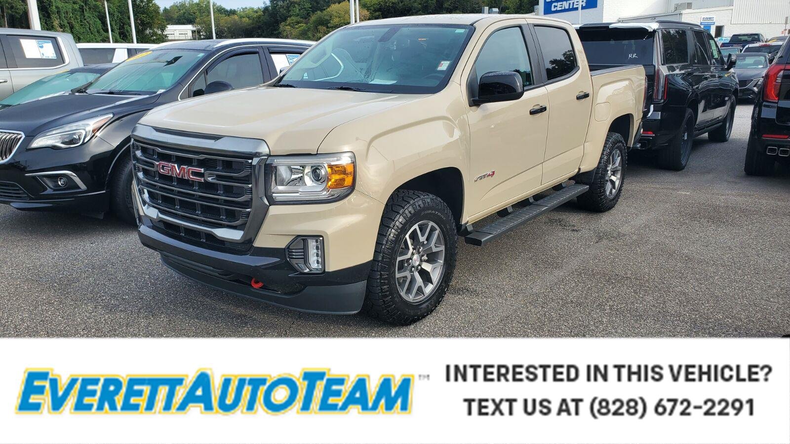 Used 2022 DESERT SAND METALLIC GMC 4WD AT4 w/Cloth image 1