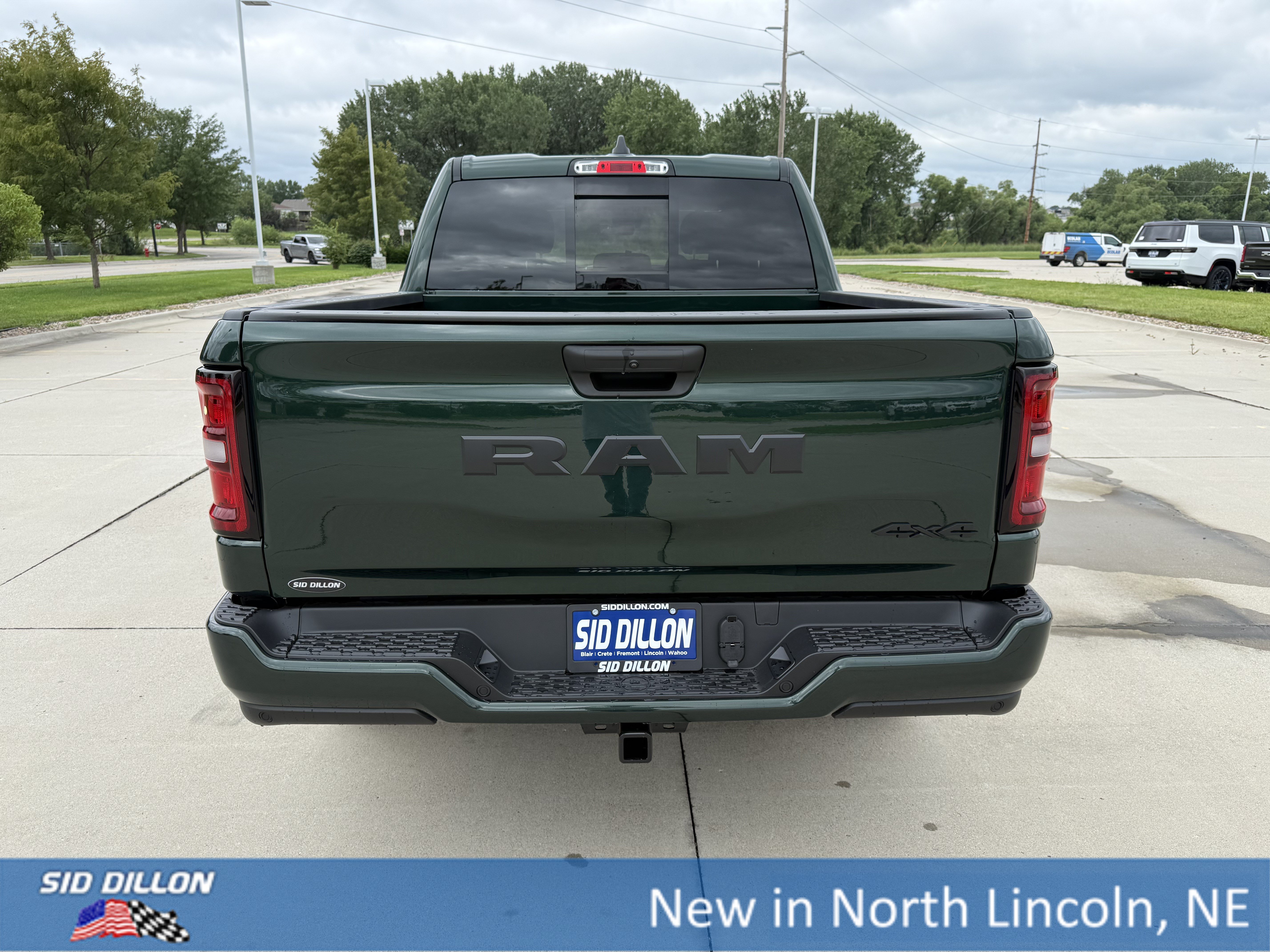 New 2026 Serrano-Green Metallic Exterior Paint RAM 4WD CREW 5