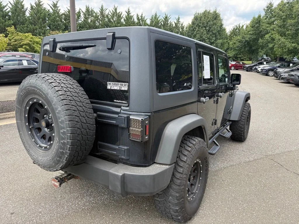 Used 2011 Black Jeep Unlimited Sport image 7