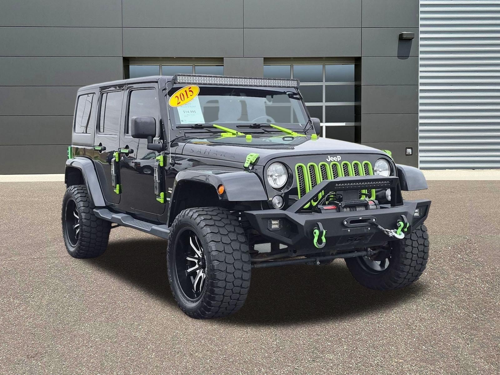 Used 2015 Black Clearcoat Jeep Sahara image 3