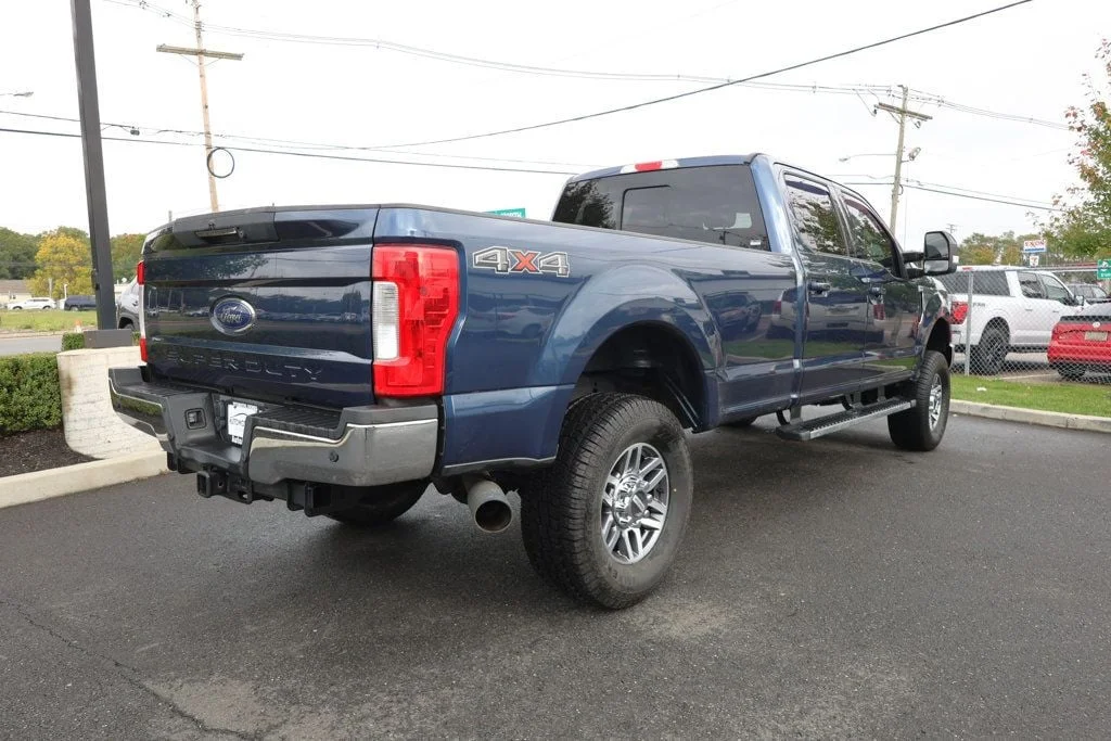 Used 2019 Blue Jeans Metallic Ford LARIAT 4WD Crew Cab 6.75