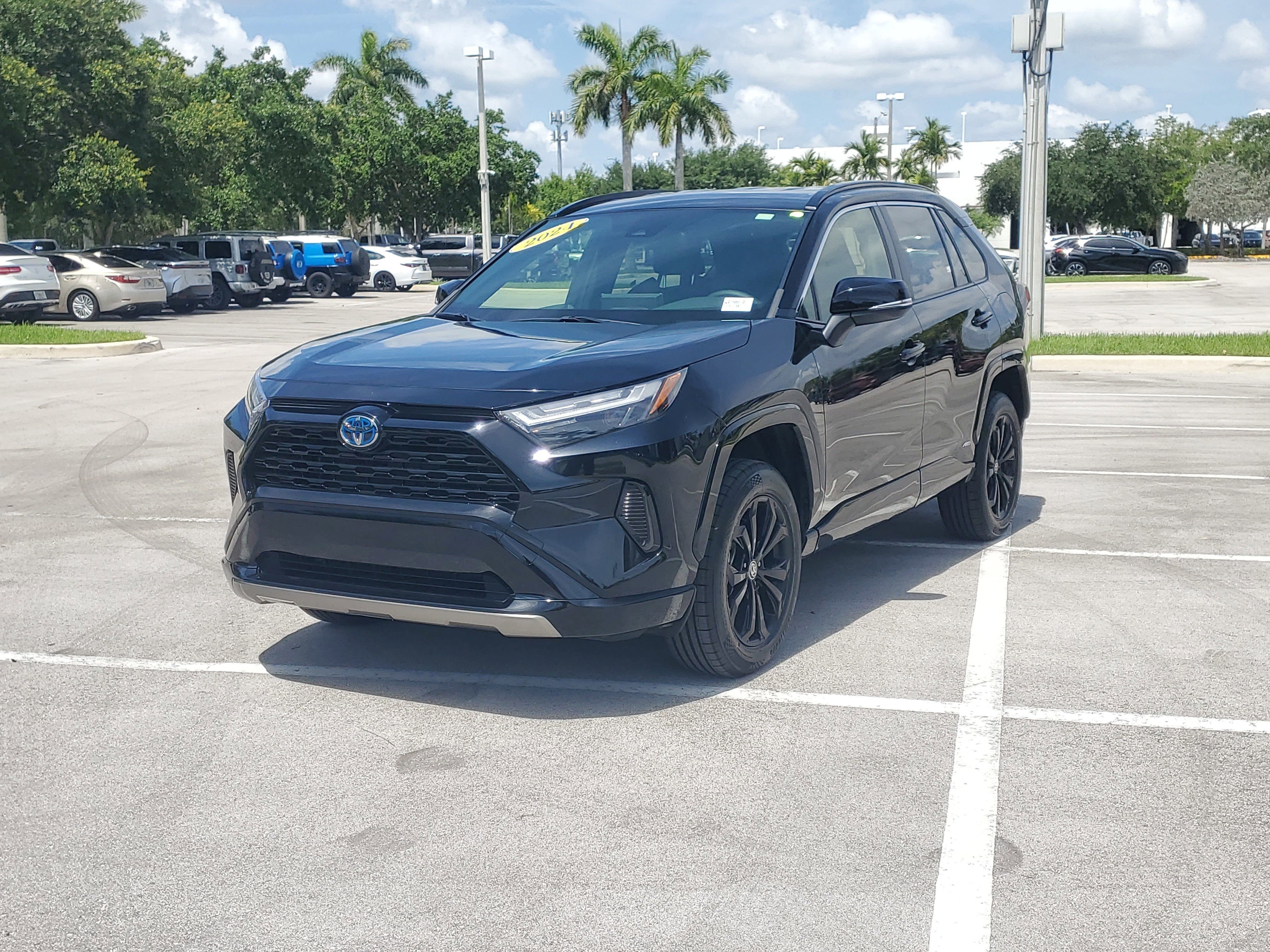 Used 2024 Midnight Black Metallic Toyota Hybrid SE image 7