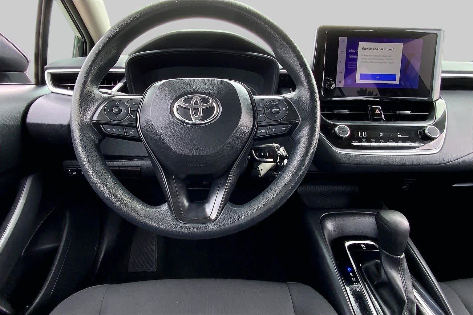 Used 2024 Midnight Black Metallic Toyota LE image 6